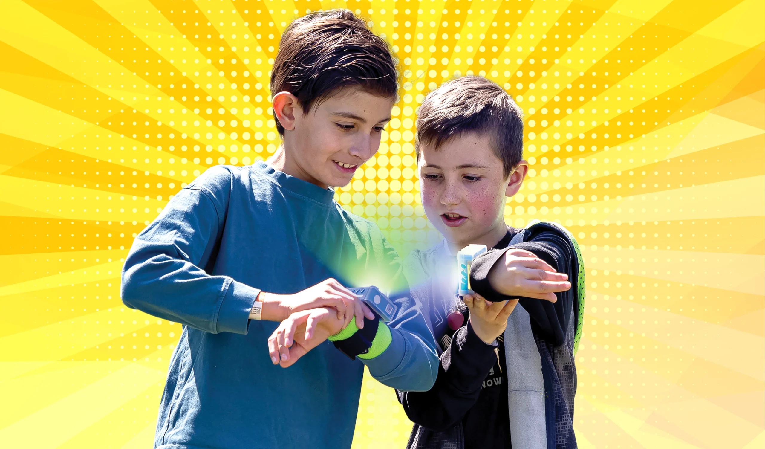 Two kids interacting with ZTAG wearable devices